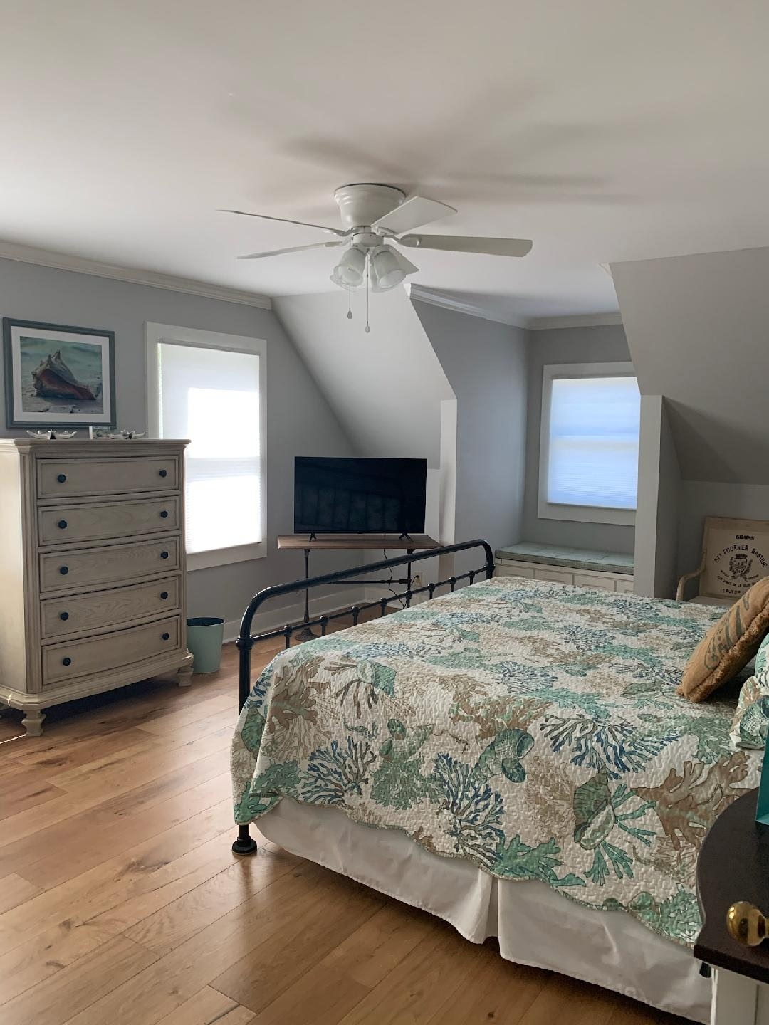 Beautifully renovated bedroom with hardwood flooring