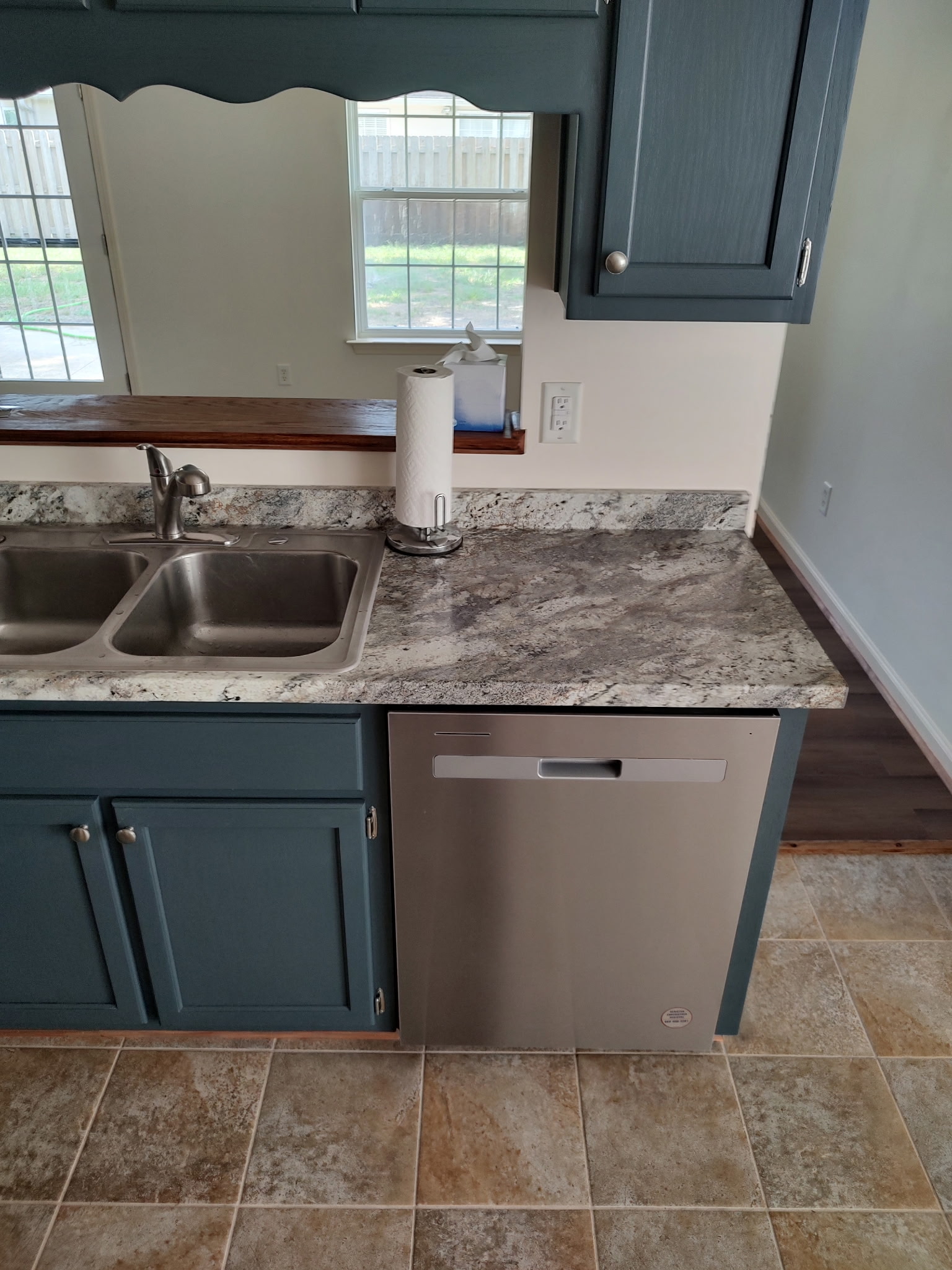 Kitchen renovation with granite countertops and custom cabinetry